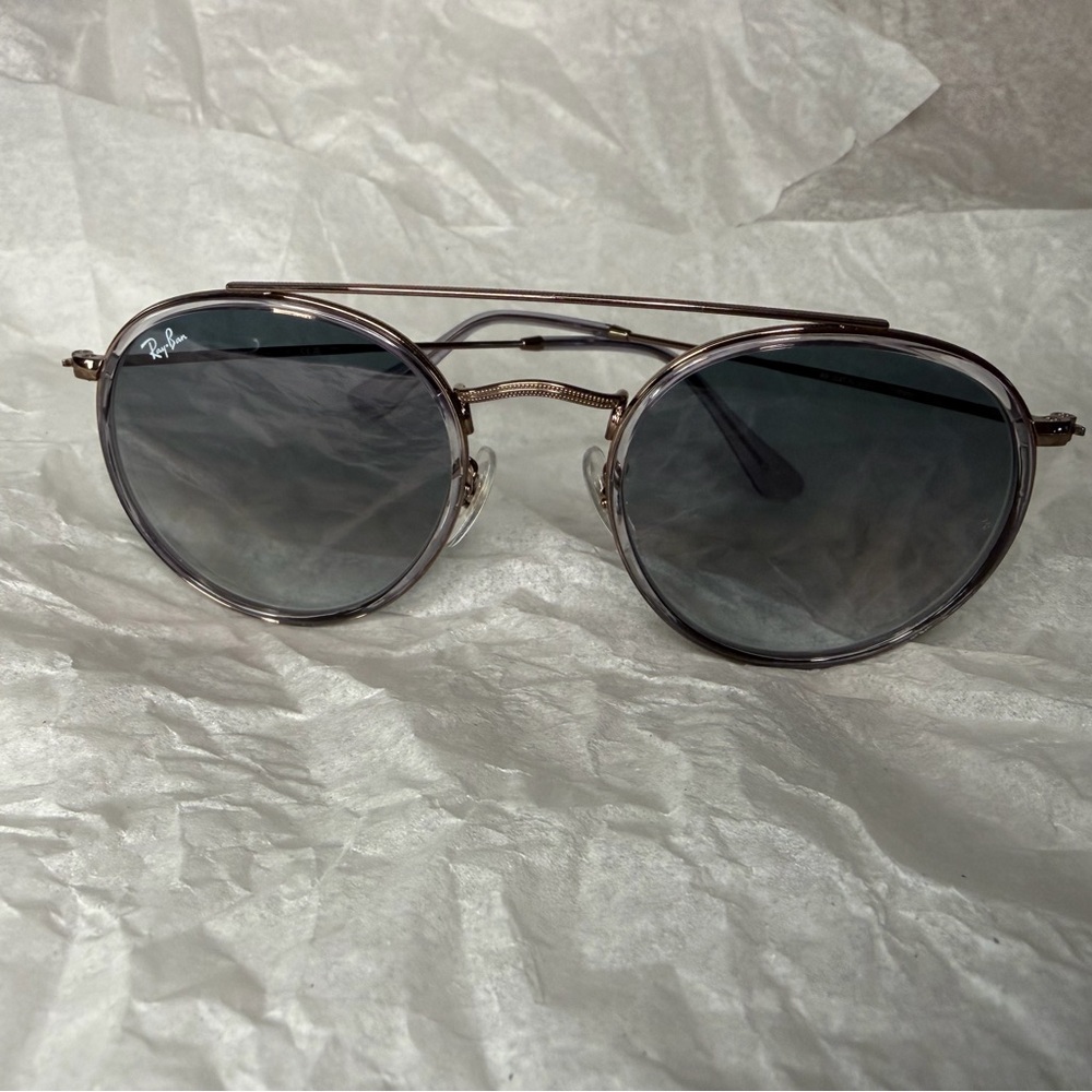 Ray-Ban RB3647-N dark silver frames gray (slight purple) gradient lenses.